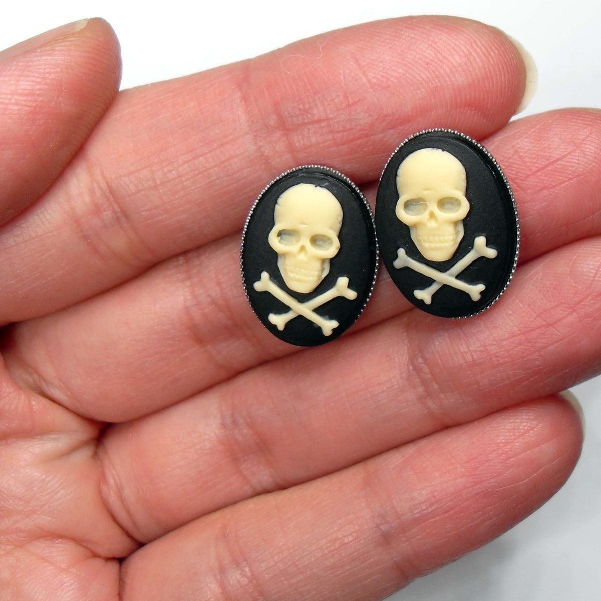 Skull and sales crossbones stud earrings
