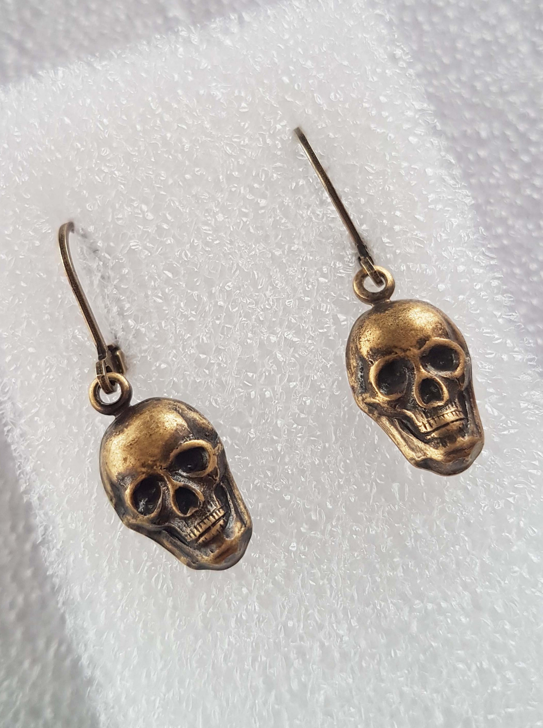 TINY SKULLS CHARM EARRINGS | THEBLACKWARDROBE.COM.