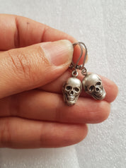TINY SKULLS CHARM EARRINGS | THEBLACKWARDROBE.COM.