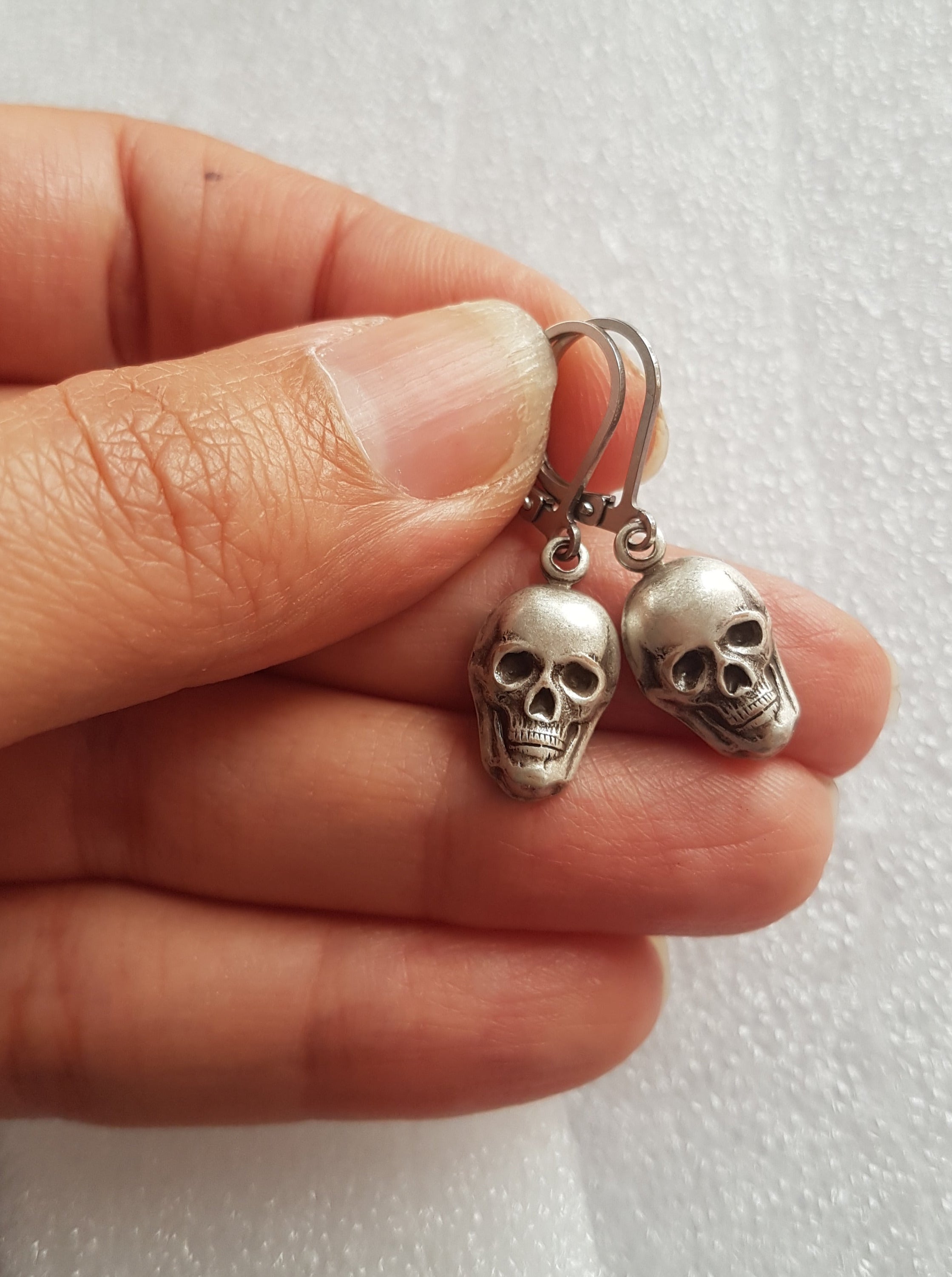 TINY SKULLS CHARM EARRINGS | THEBLACKWARDROBE.COM.