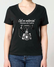 A woman modeling a black V-neck t-shirt with a Vintage graphic print of a rotary phone and the text 'Call me antisocial but please don't call me'.