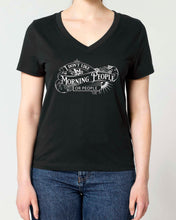 A woman modeling a black v-neck t-shirt with a white graphic print that reads 'I DON'T LIKE MORNING PEOPLE ANY MORE' in a Gothic Victorian vintage-style font. 